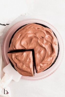 Small chocolate cake with fluffy chocolate whipped cream frosting.