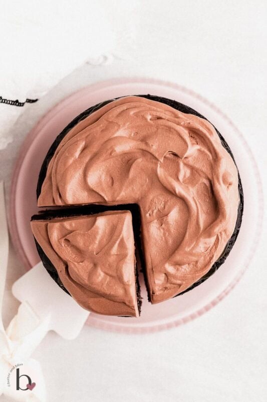Small chocolate cake with fluffy chocolate whipped cream frosting.