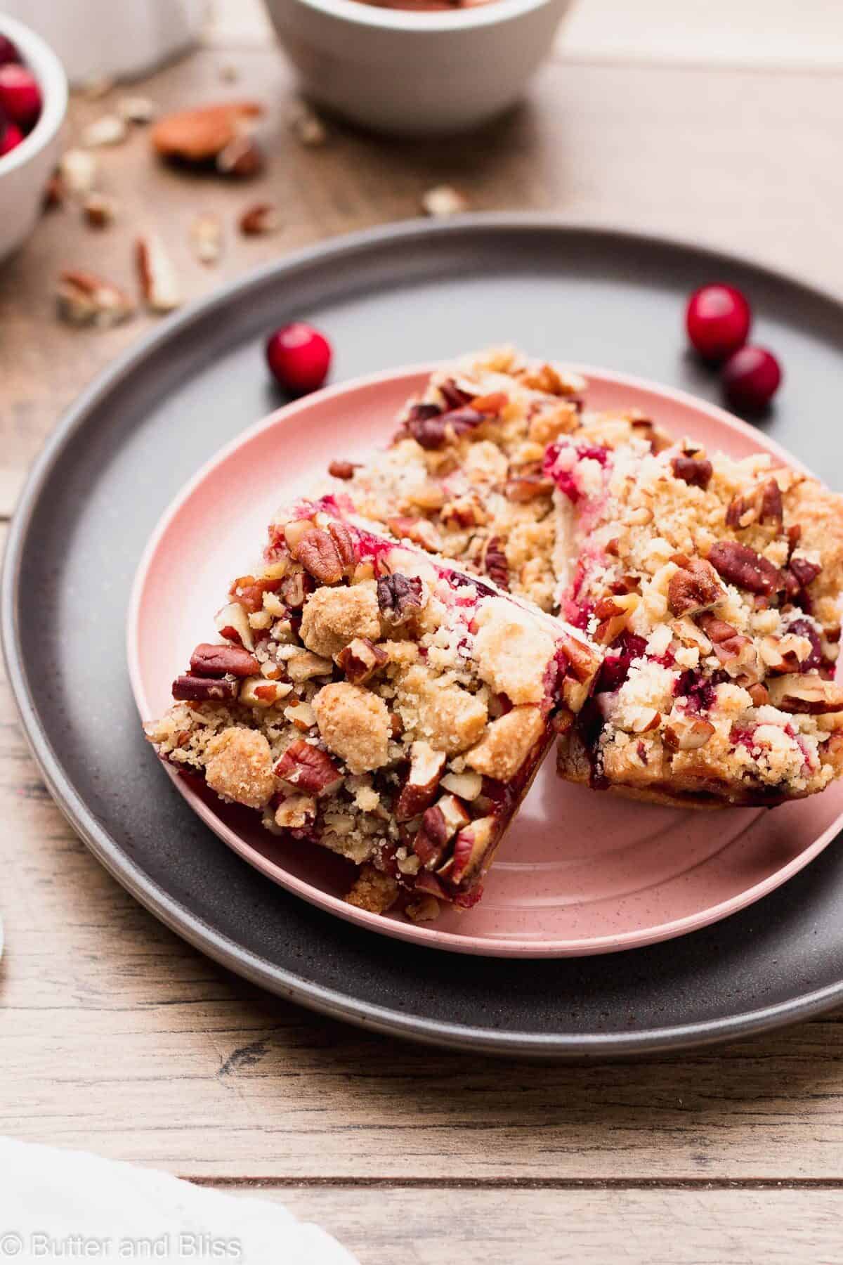 Plate of cranberry bars with nut crumble