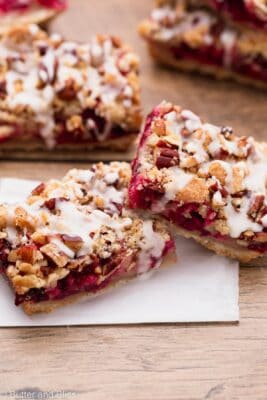 Two cranberry bars stacked on a table