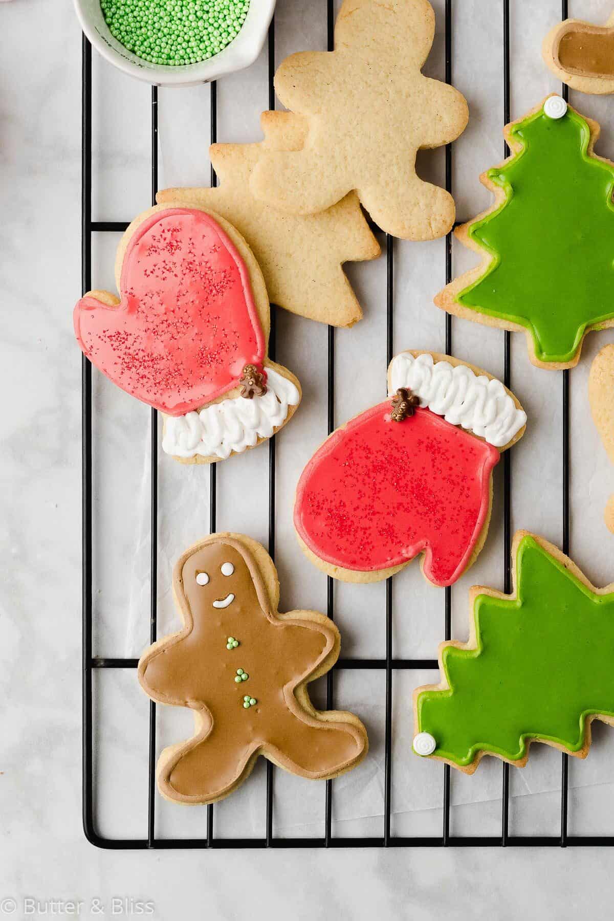 Decorated gluten free sugar cookie cut outs on a rack