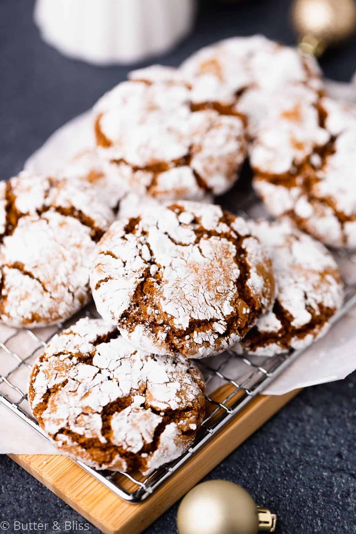 Close up of a molasses crinkle cookie on a wire rack