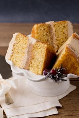 Vanilla gingerbread cream cake slices on a cake platter