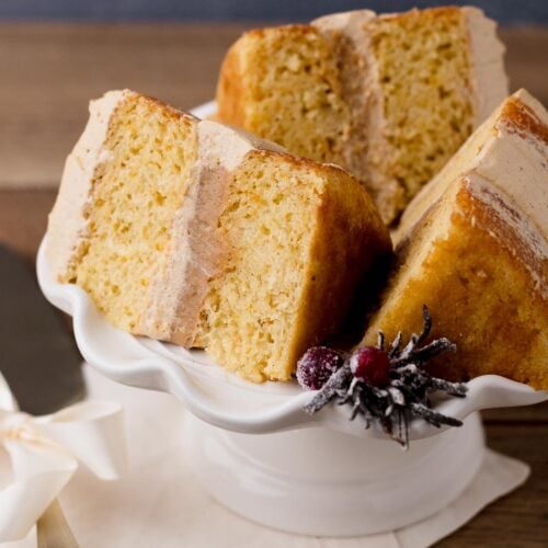 Vanilla gingerbread cream cake slices on a cake platter