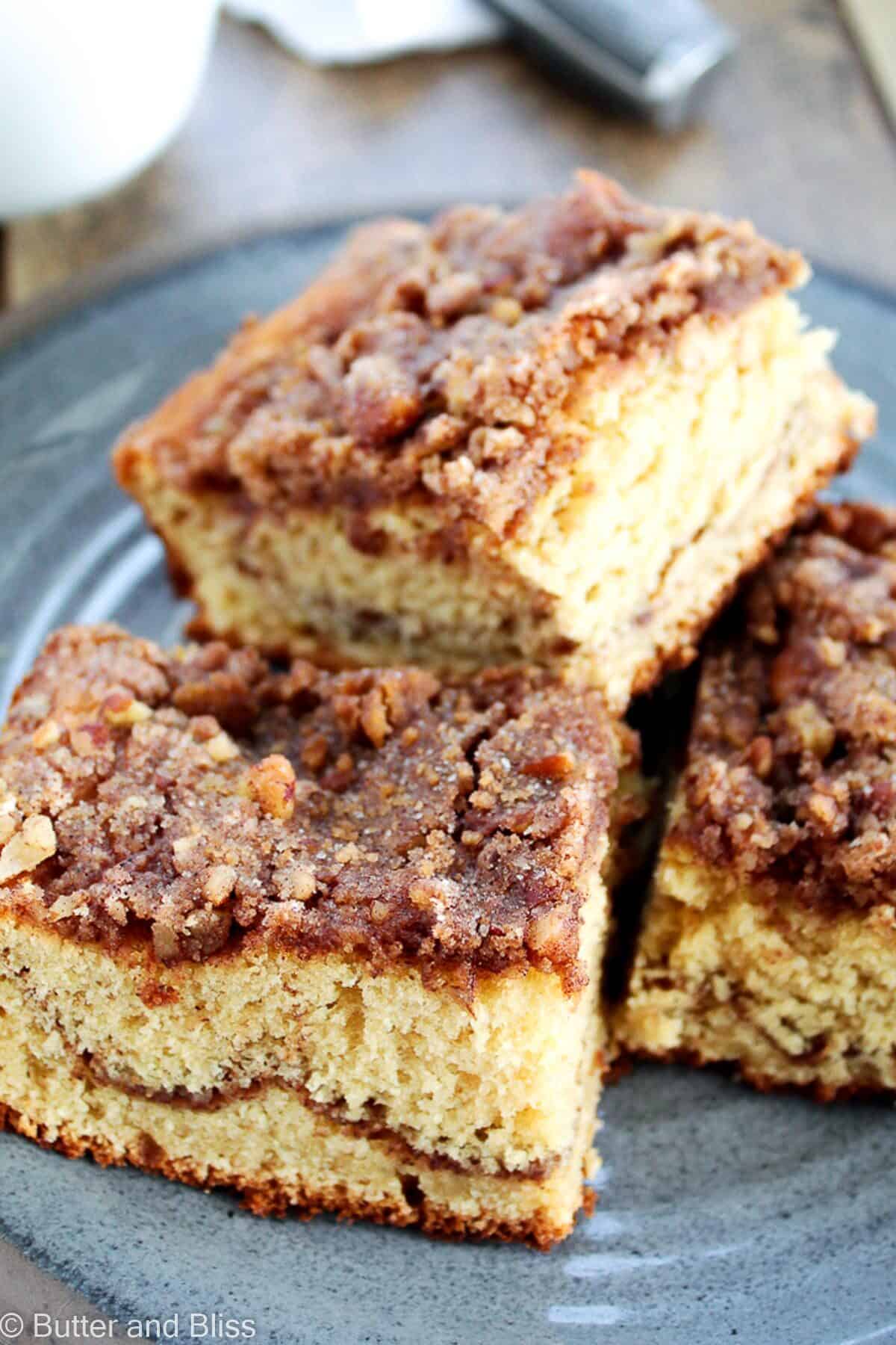 Applesauce coffee cake squares on a platter.