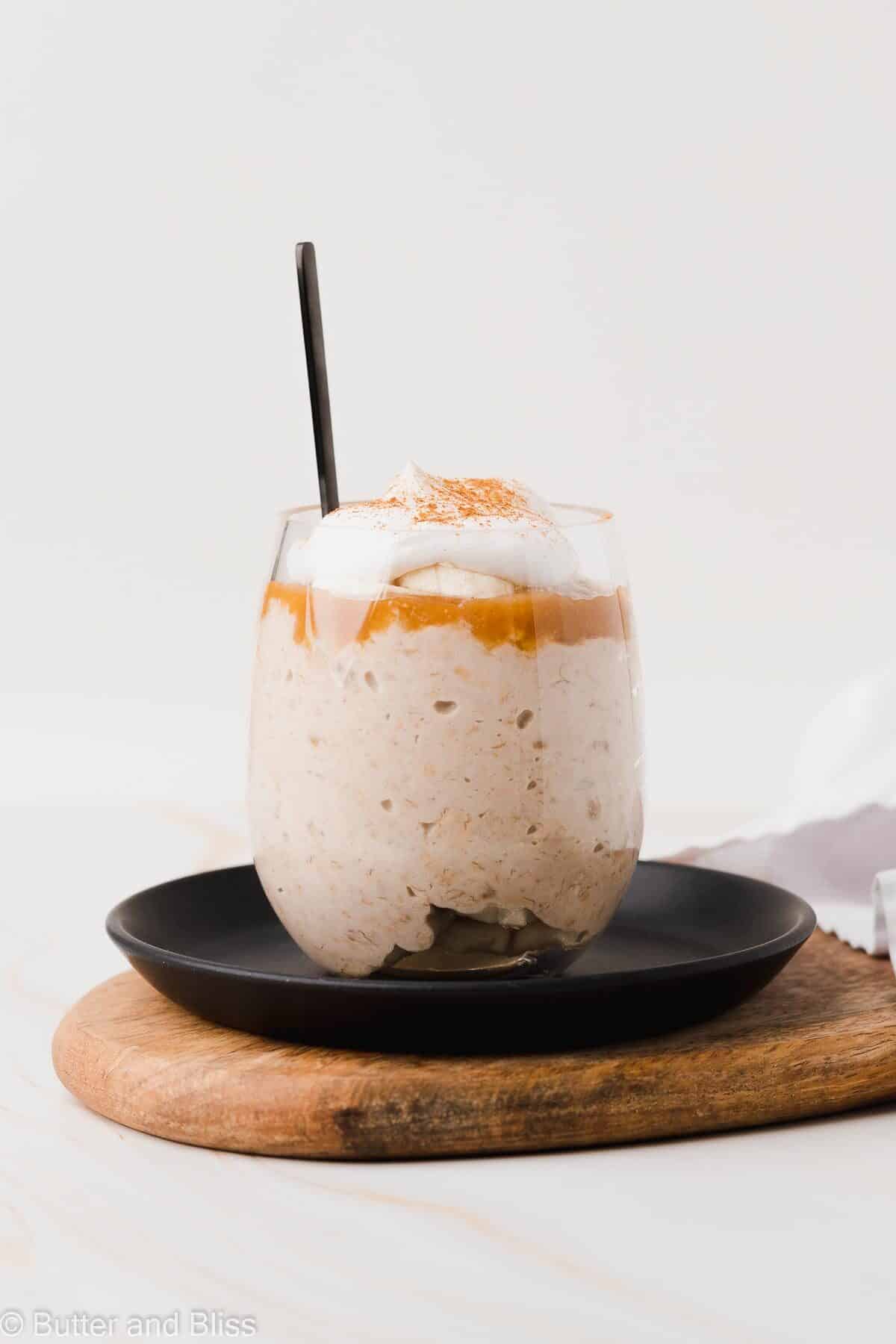Single serving of caramel banana overnight oats in a serving glass