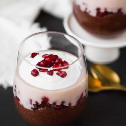 Chocolate chia pudding with pomegranate and yogurt in a glass