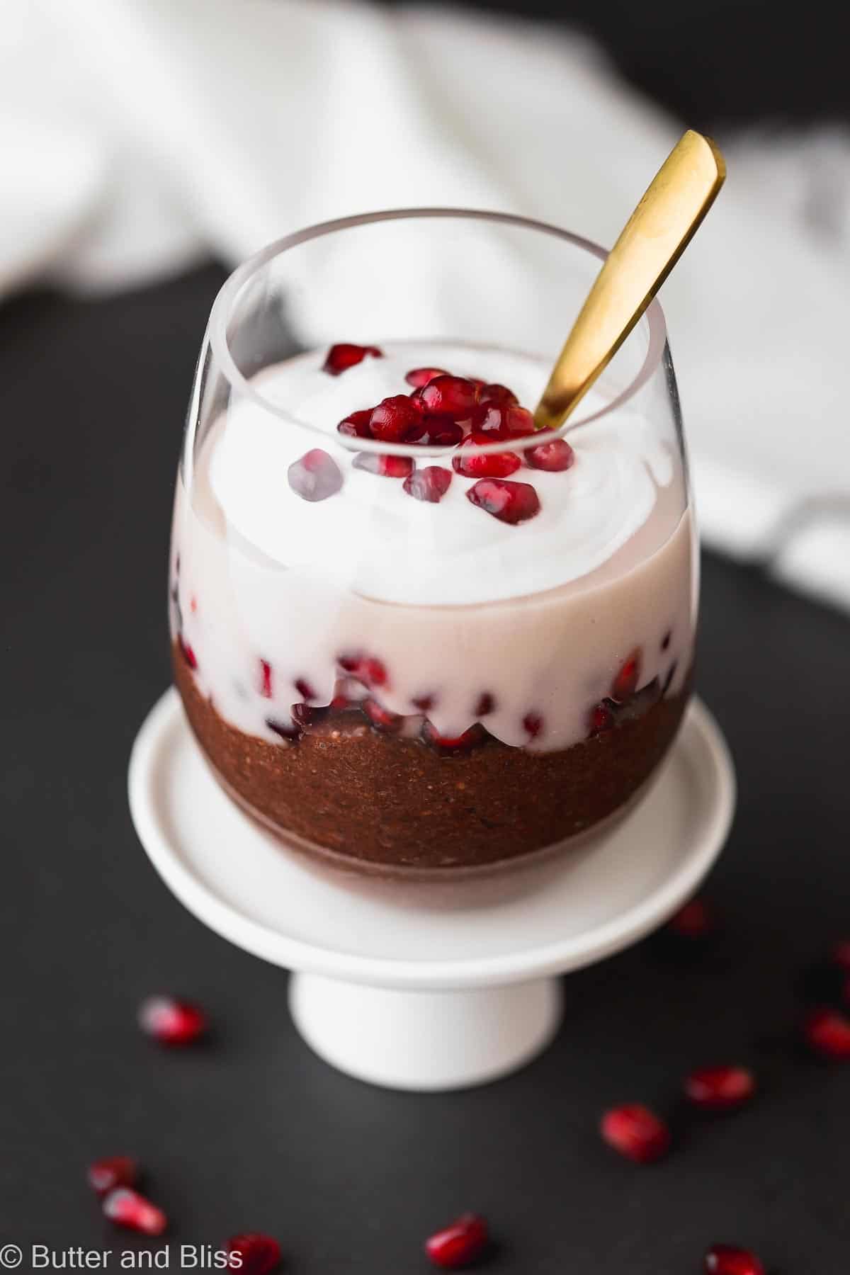 Chocolate chia pudding in a glass on a small plate