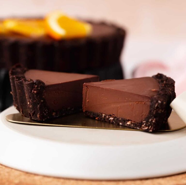 Small slices of chocolate orange gluten free tart on a cake server