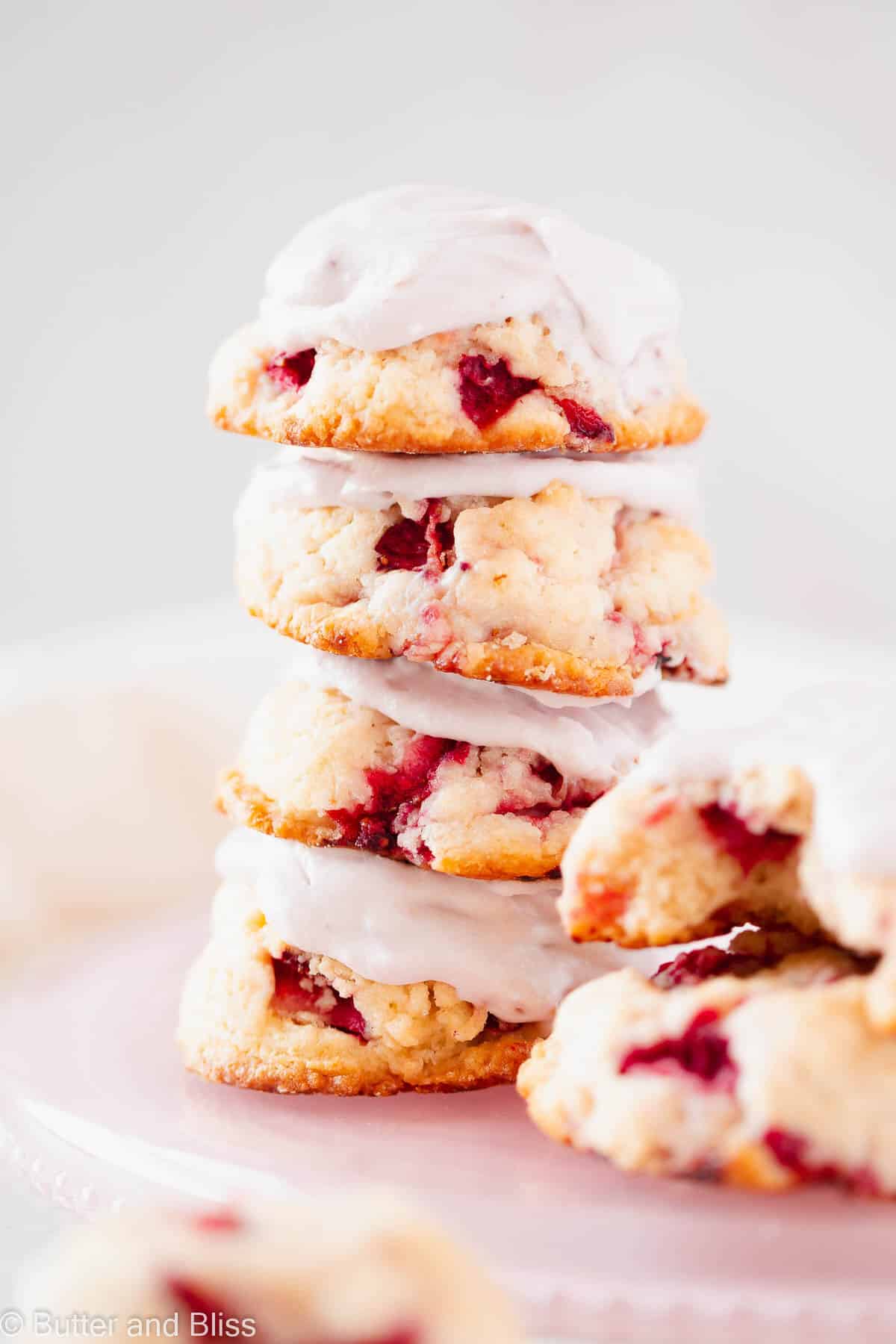 Stack of strawberry shortcake biscuit cookies on a pink plate