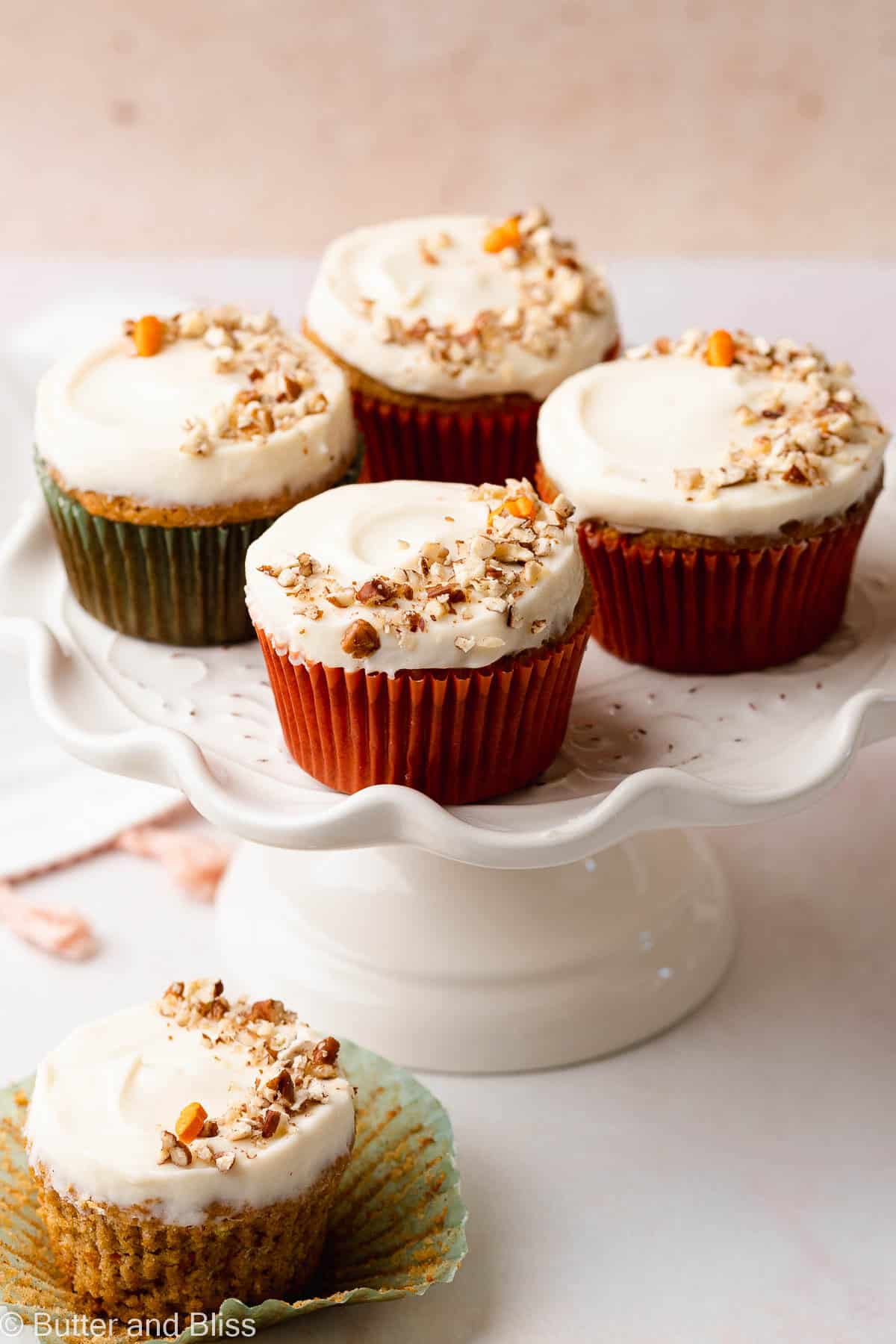 Close up of gluten free carrot cake cupcakes on a cake platter