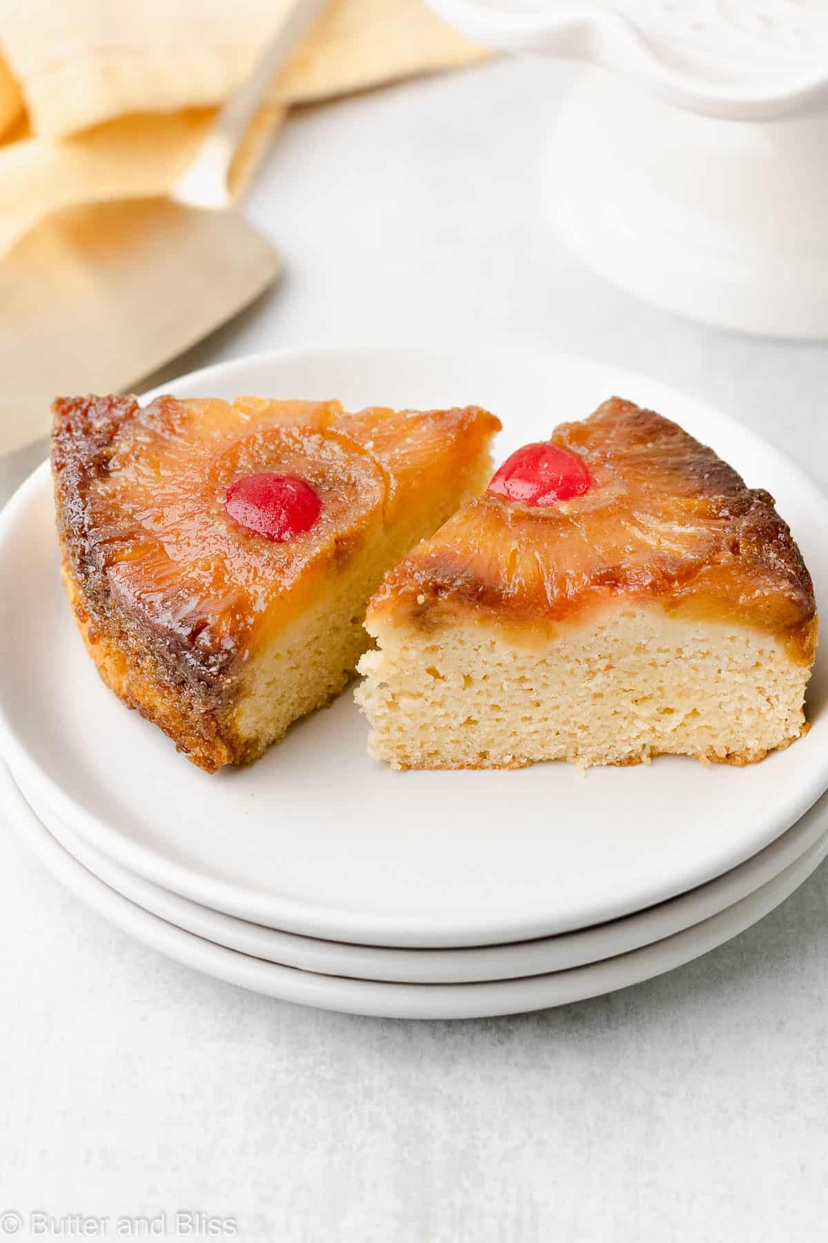 Two slices of pineapple cake on a white plate