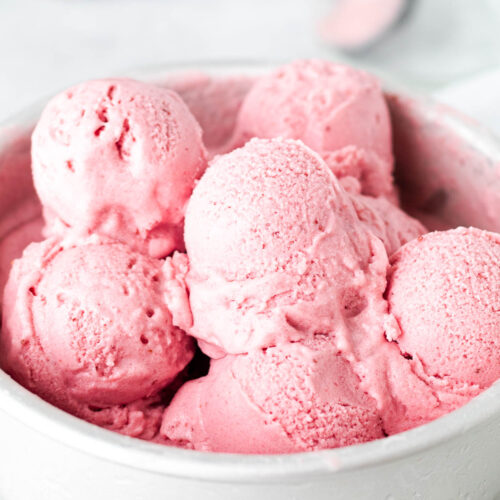 Pre scooped strawberry ice cream in a silver tin