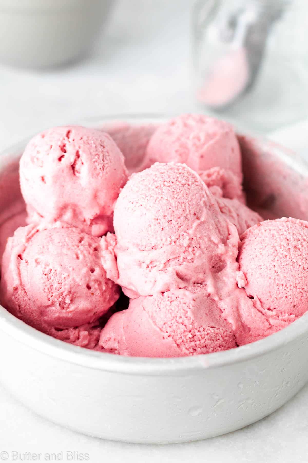 Pre scooped strawberry ice cream in a silver tin