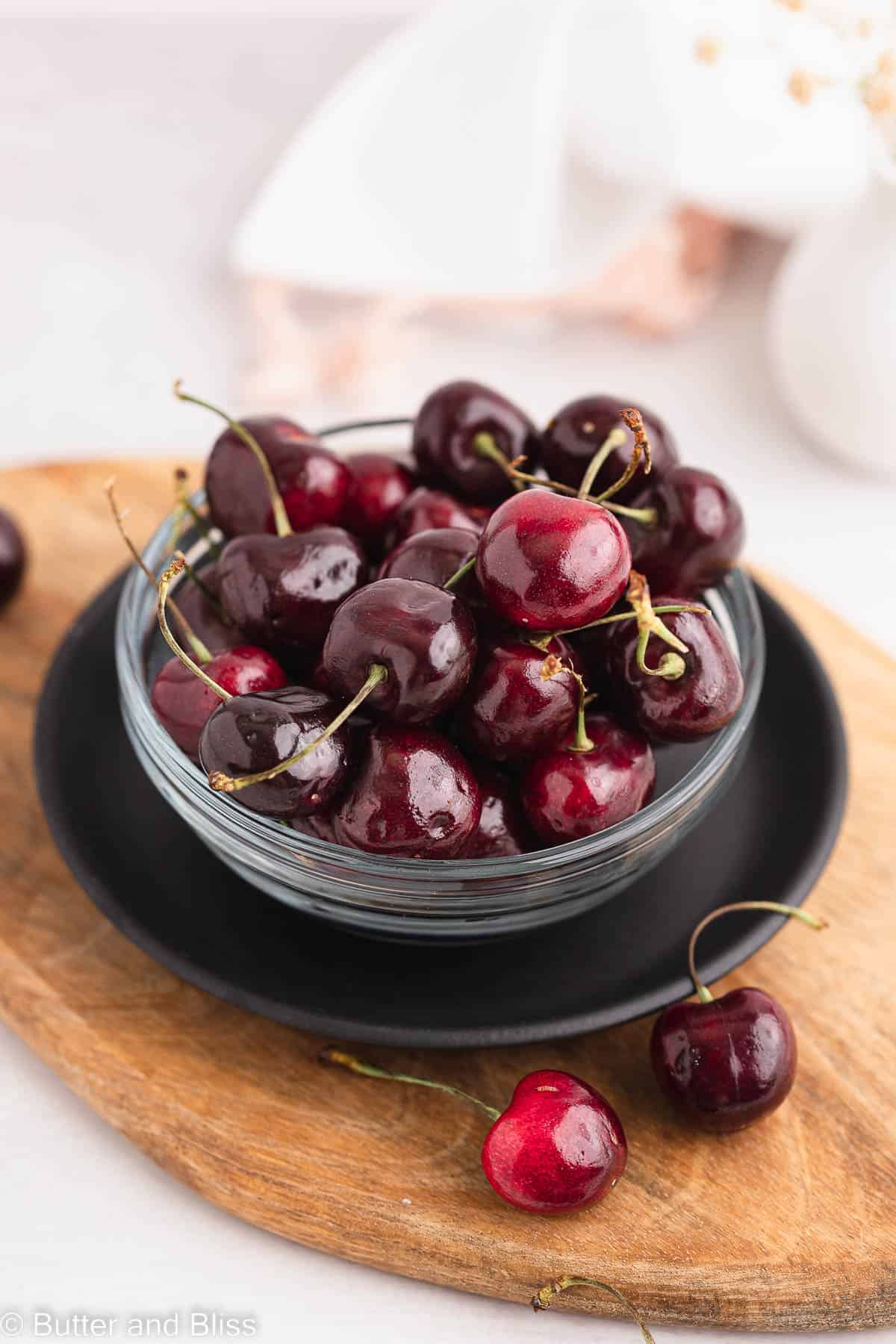 Bowl of fresh cherries set on a table