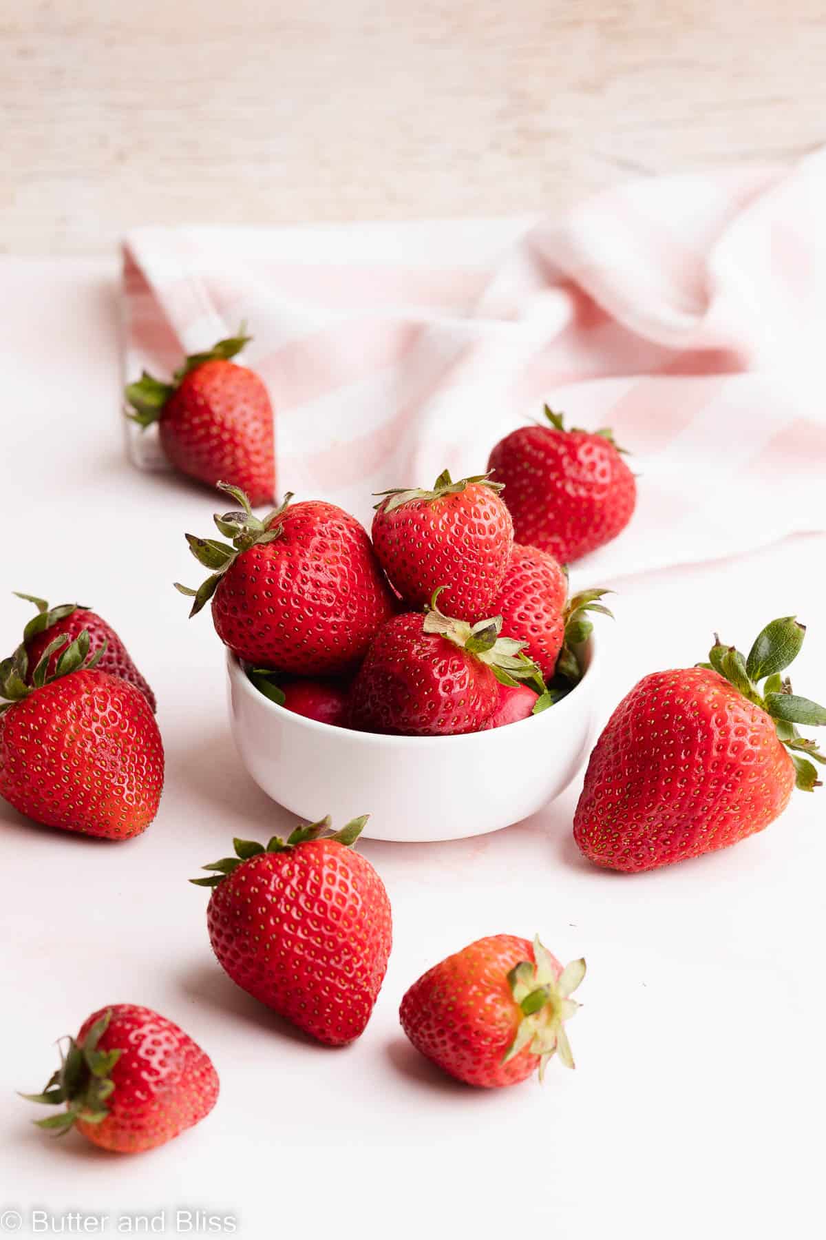 Fresh strawberries in a bowl on a table