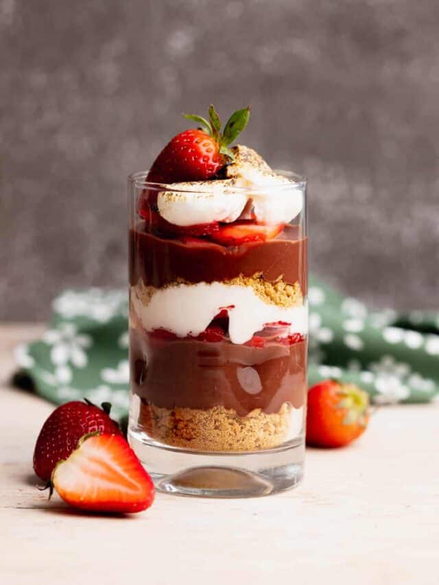 Single serving of strawberry smores parfait in a serving glass