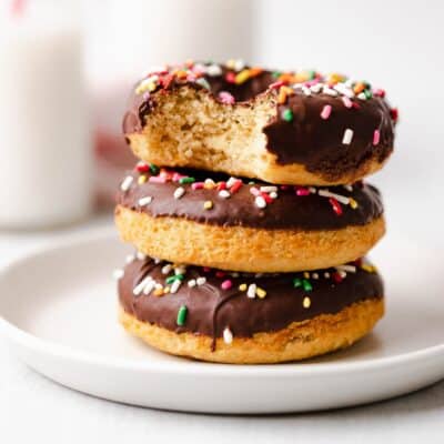 Stack of gluten free vanilla baked donuts with chocolate glaze