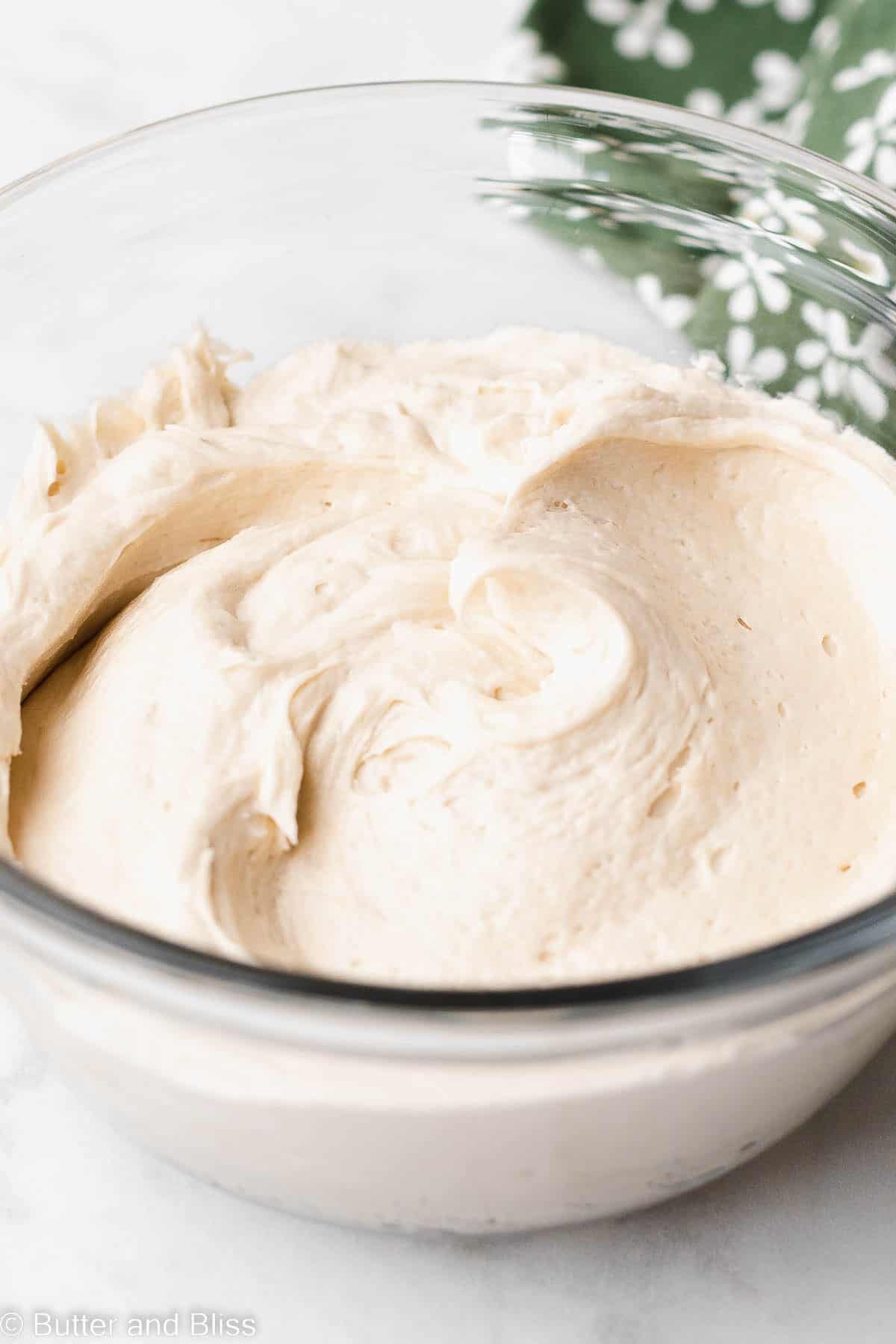 A bowl of butter free caramel frosting.