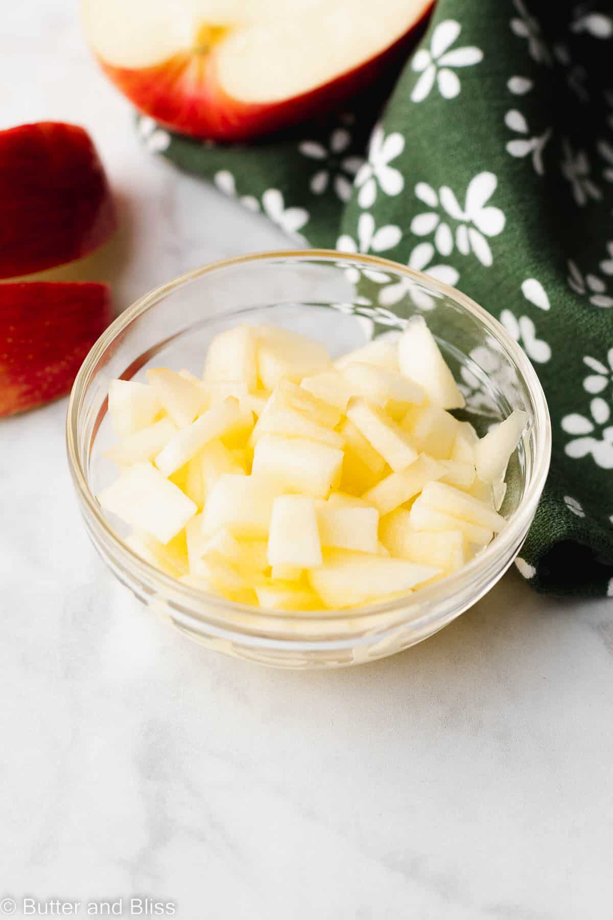 Diced apples in a small glass bowl.