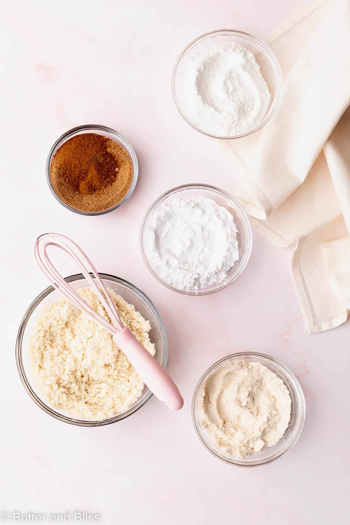 Gluten free flours in small mixing bowls on a table