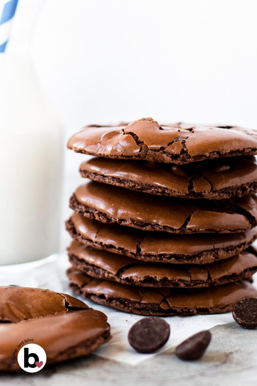 Small stack of flourless chooclate cookies with brownie top crackle.