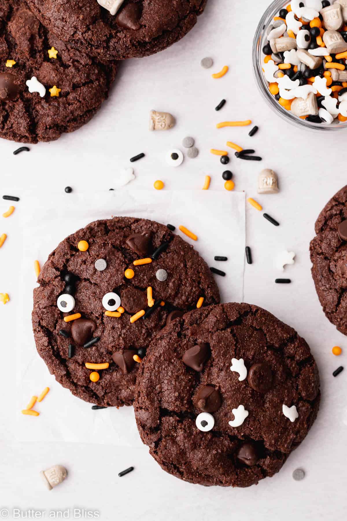 Cookies decorated with halloween sprinkles on a table.