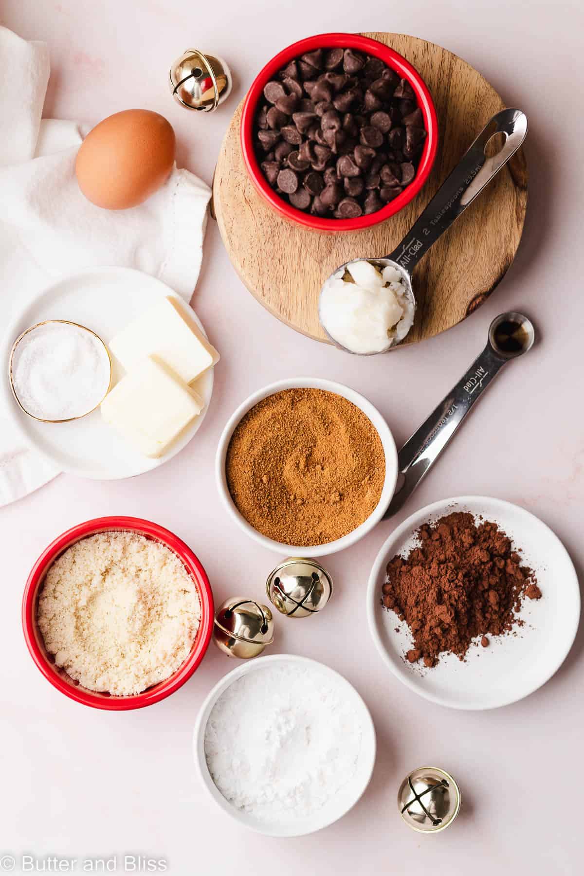 Ingredients for holiday brownies in small bowls arranged on a table.