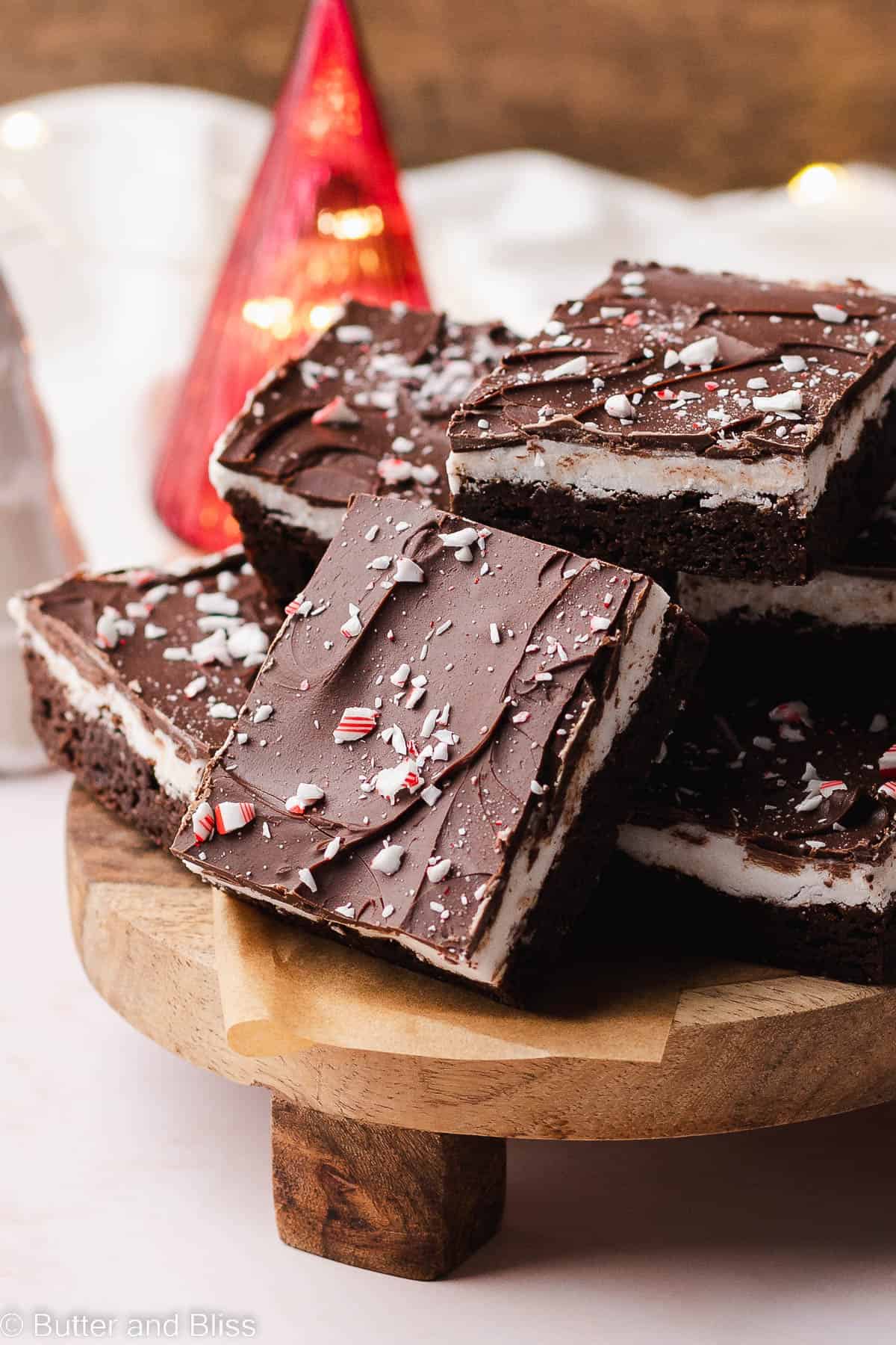 Bright chocolate shell on a gluten free peppermint brownie square.