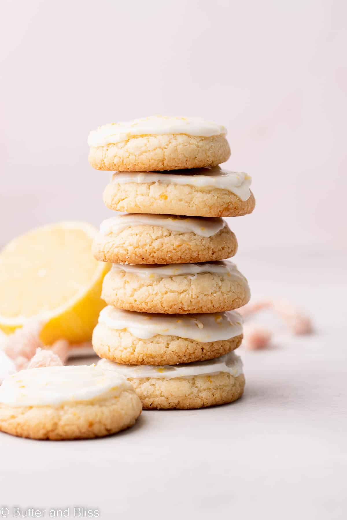 A neat stack of lemon gluten free shortbread cookies with a lemon glaze.