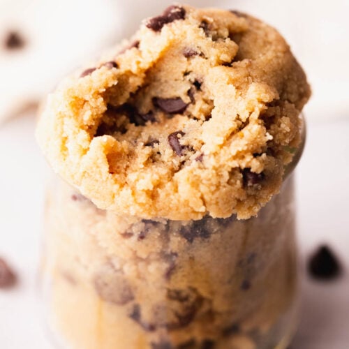 Edible gluten free cookie dough spooned into a small glass cup.