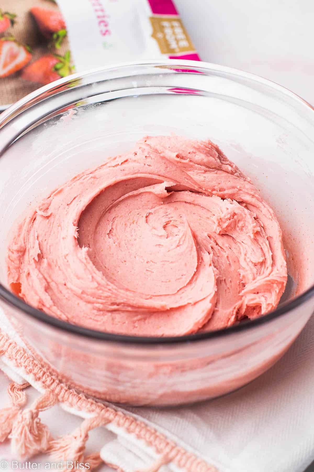 Butter free strawberry frosting in a glass bowl.