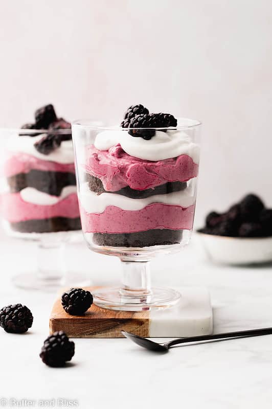 Layers of mango mousse and chocolate cake in a pretty trifle glass.