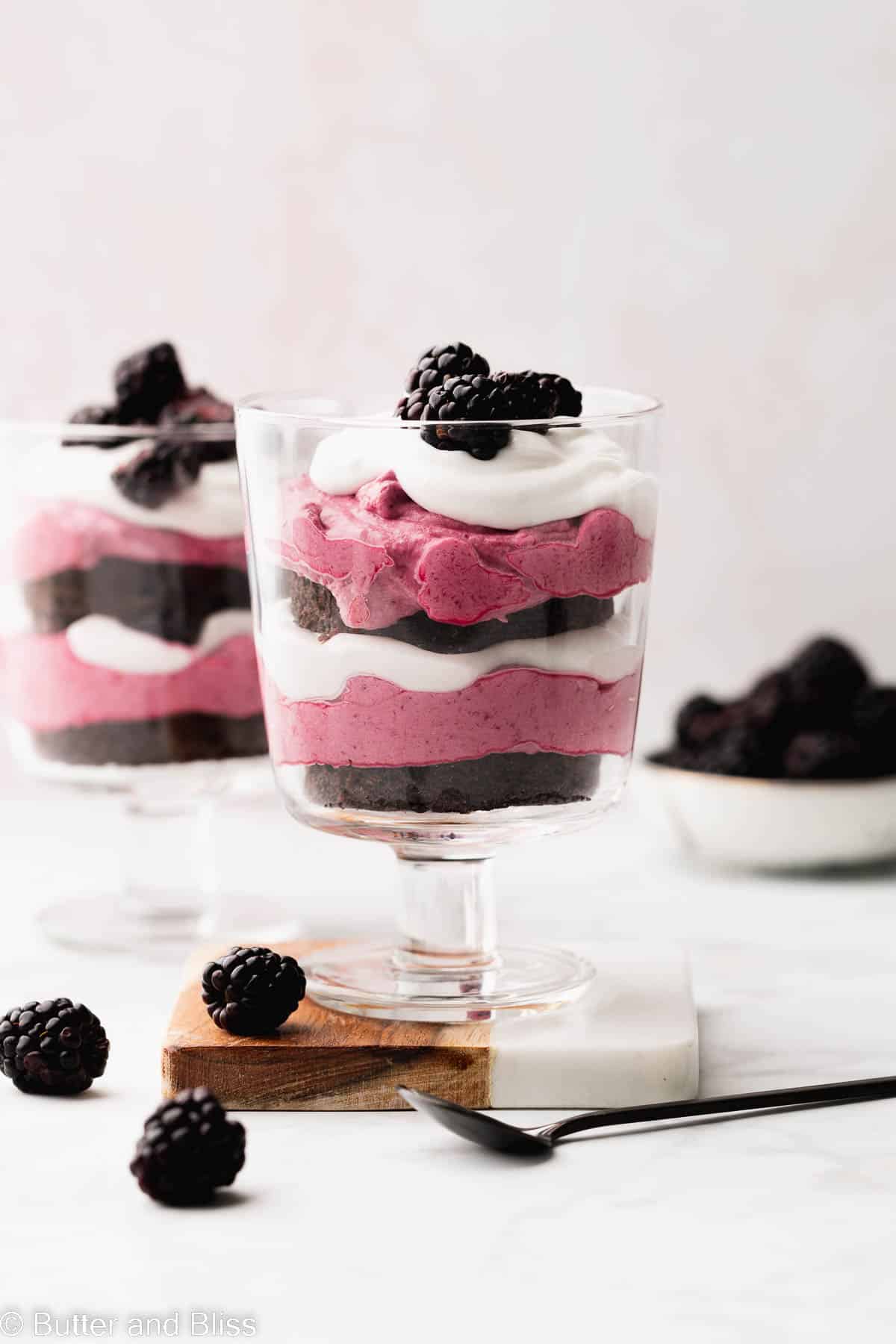 Layers of blackberry mousse and chocolate cake in a pretty trifle glass.