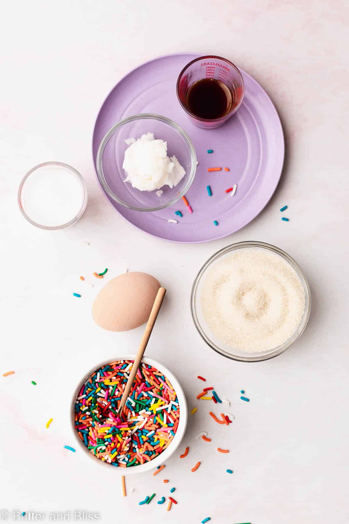 Wet ingredients arranged in pretty little bowls for gluten free vanilla cupcakes.