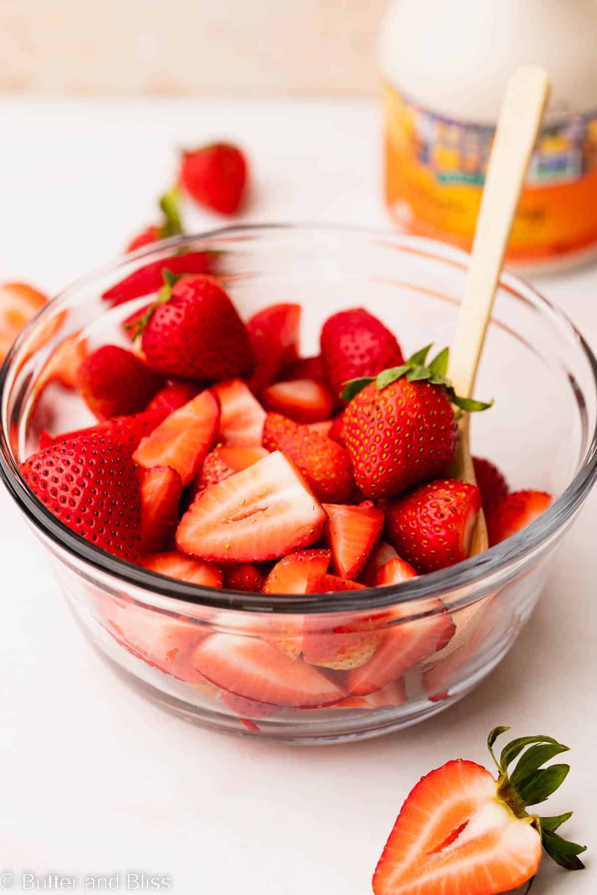 A bowl of fresh chopped strawberries.