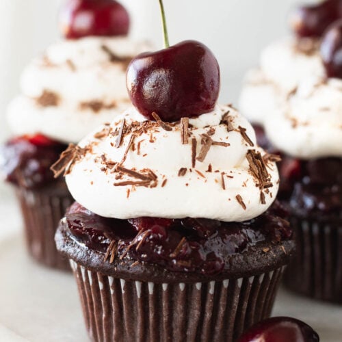 Small batch black forest dessert cupcakes on a white plate.
