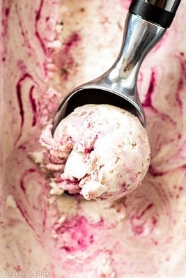 A delicious scoop of no churn chocolate cherry ice cream.