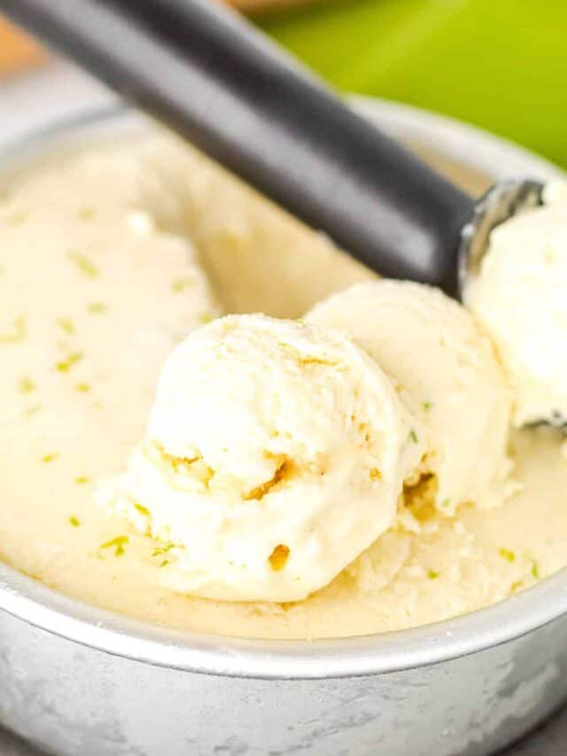 Creamy scoops of pina colada ice cream in an ice cream tin.
