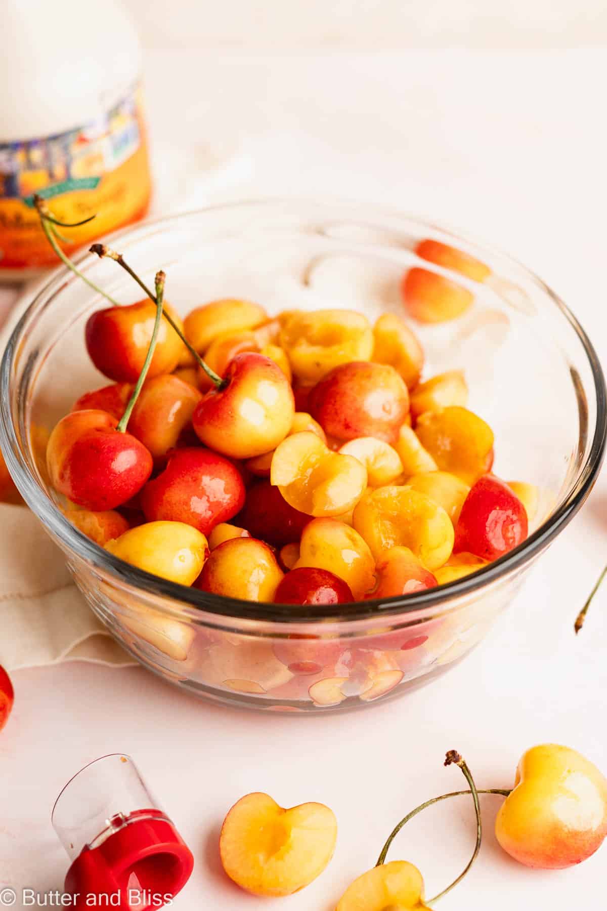 A pretty bowl of fresh sliced Rainer cherries.