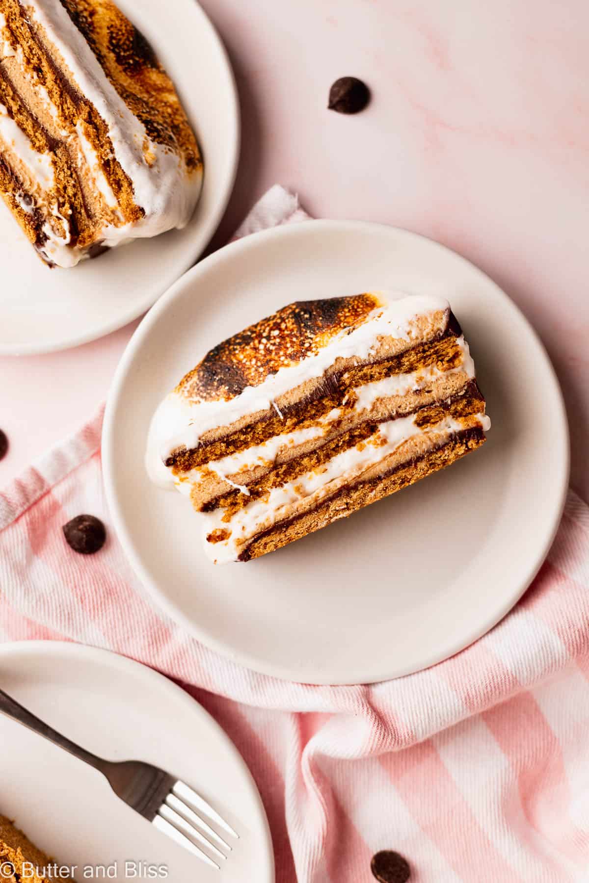 Pretty slice of gluten free s'mores icebox cake on a white plate.