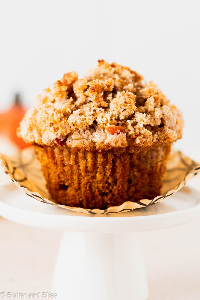 Pretty fall breakfast treat perched on a white cupcake stand.