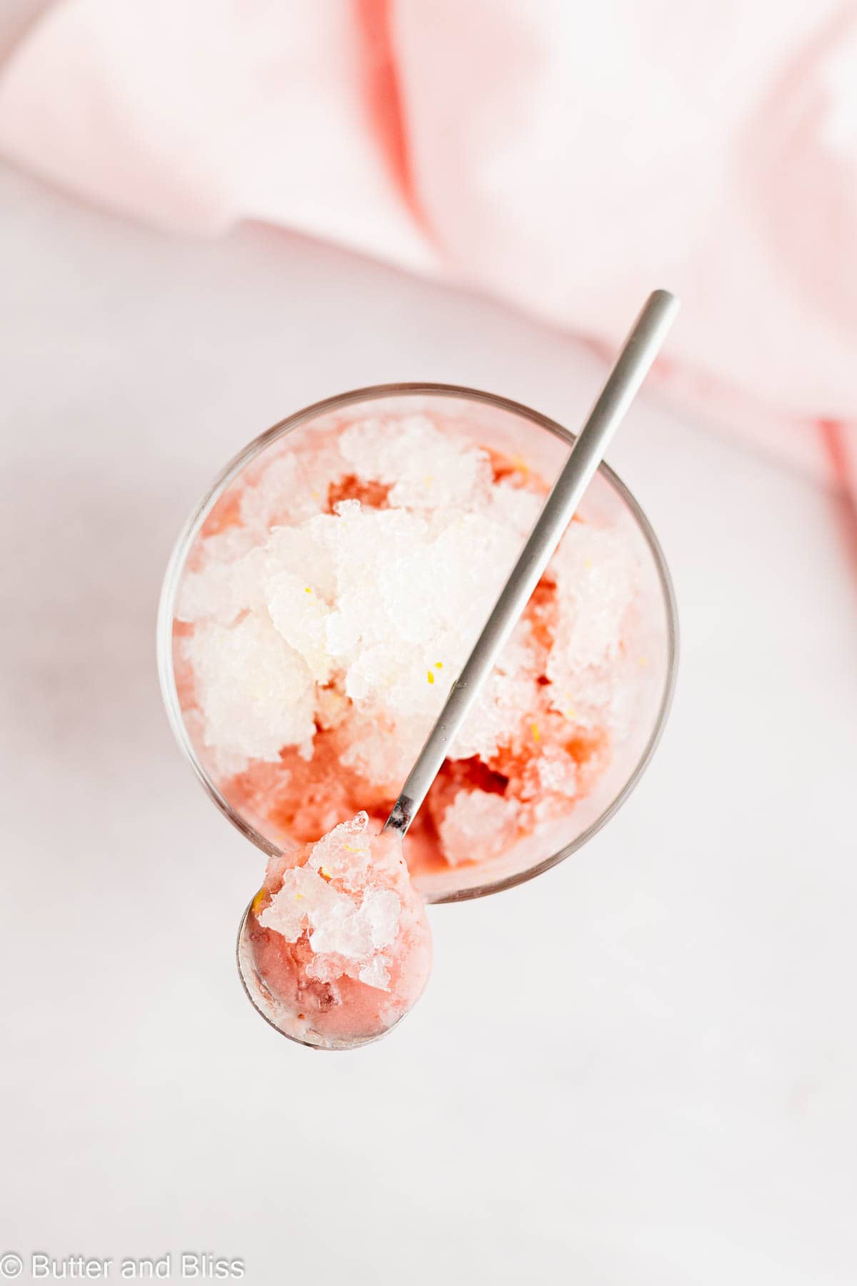 Pretty spoonful of chilly lemonade granita and strawberry pudding.