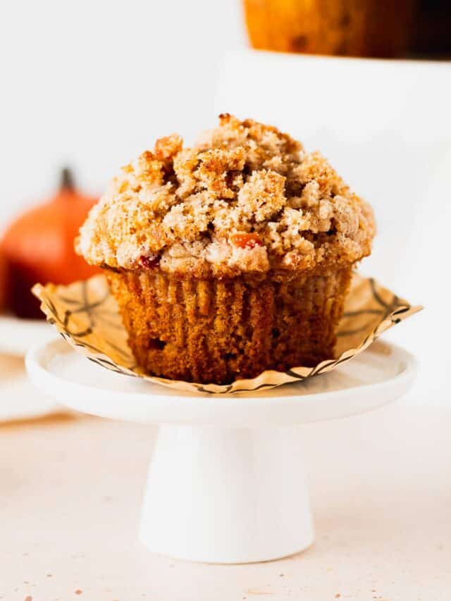 Single pumpkin apple muffin on a mini cupcake stand.