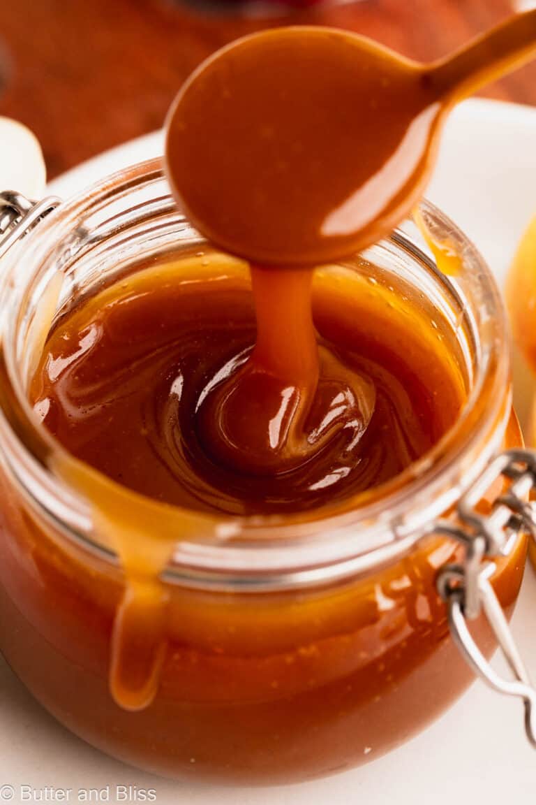 Silky ribbons of apple cider maple syrup caramel sauce in a cute glass jar.