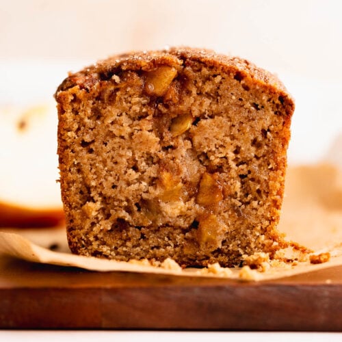 View of cut gluten free apple spice bread full of caramelized apples.