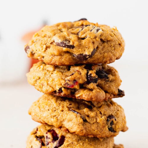 A pretty stack of tasty pumpkin oatmeal cookies studded with chocolate chips and cranberries.