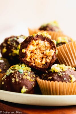 Bite shot of the inside of popping apple rice candy truffle topped with pop rock candy.