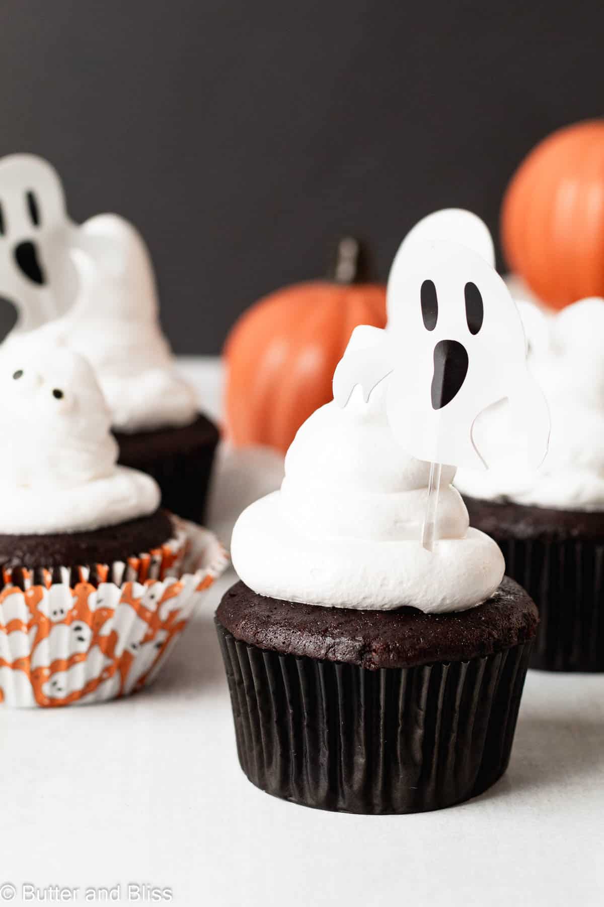 Cute Halloween chocolate cupcakes topped with homemade marshmallow meringue ghosts.