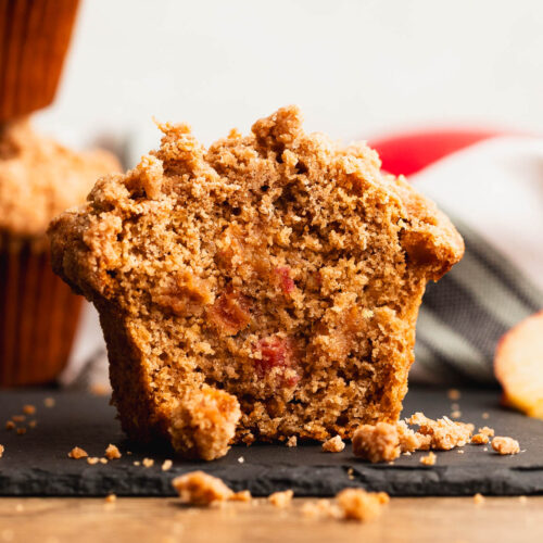 Delicious inside of an apple gluten free muffin dotted with apple chunks.